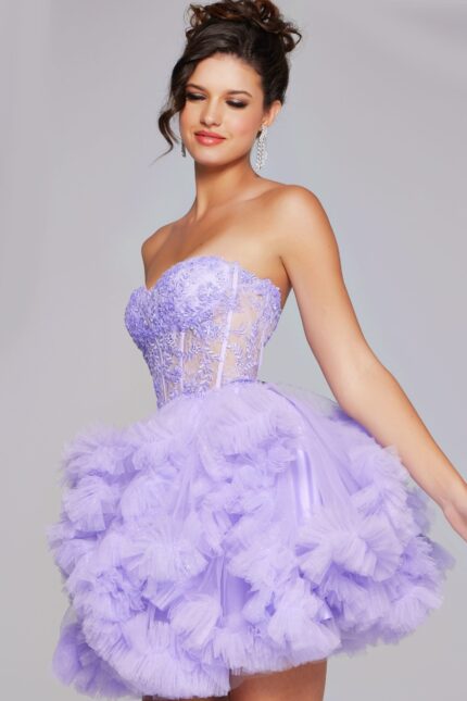 Model wearing Jovani 40628 dress in lilac with lace bodice and tulle skirt from the side