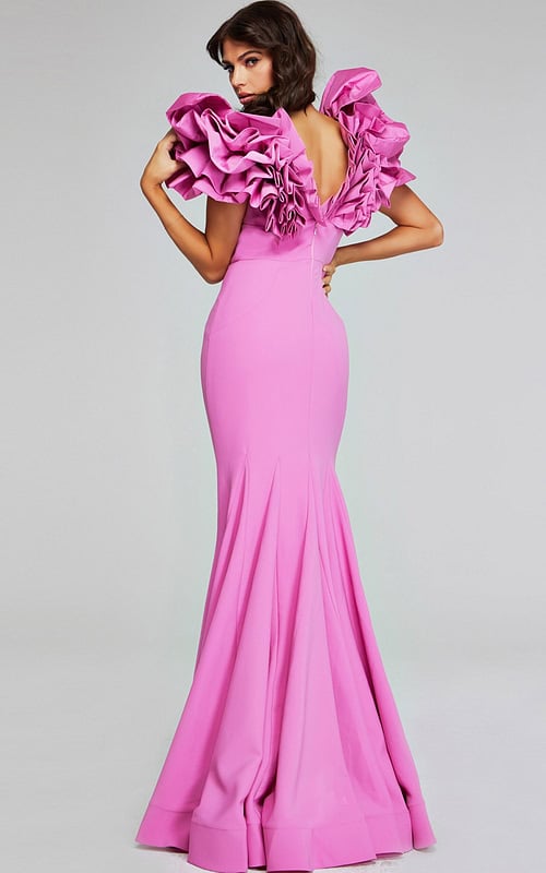 Model wearing Jovani 40663 pink mermaid dress showing the back with ruffled design