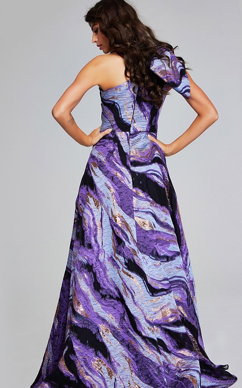 model wearing Jovani 40695 purple gown, back view highlighting flowing skirt