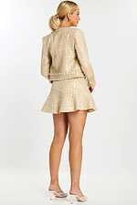 Back view of short champagne sequin dress and coordinating textured jacket