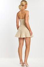 Rear view of strapless tweed mini dress with flared hem