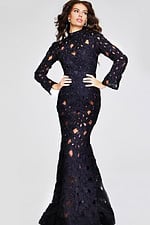 Model wearing Jovani 40743 elegant black lace gown with high neckline and long sleeves, front view.