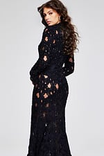 Side view of Jovani 40743 black lace gown, highlighting the gown's intricate pattern and long sleeves.