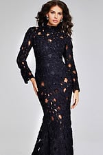 Model wearing Jovani 40743 detailed black lace gown highlighting the fitted bodice and intricate design.