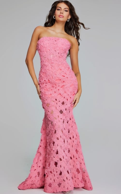 Model wearing Jovani 40744 pink gown with floral appliques, front view.