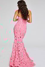 Model showcasing back view of Jovani 40744 pink gown with floral appliques.