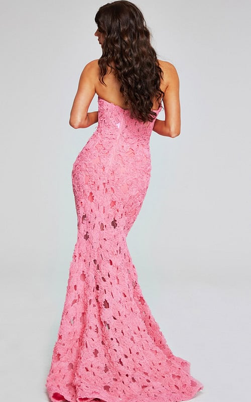 Model showcasing back view of Jovani 40744 pink gown with floral appliques.