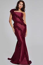Model wearing Jovani 40751 burgundy one-shoulder gown with ruffles, front view.