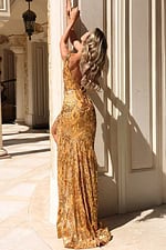 Fitted floor-length gown featuring intricate sequin detailing