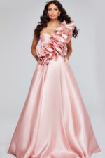 Model wearing Jovani 40796 blush gown with dramatic floral ruffles, front view.
