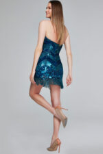 Back view of model in Jovani 40811 blue dress with beaded details.