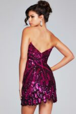 Model wearing Jovani 40812 fuchsia dress showcasing its back design.