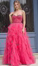 Front view of a strapless ball gown with a fitted beaded bodice and layered tulle skirt