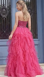 Back view of a strapless evening gown with a beaded bodice and full tiered skirt