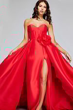 Front view of model in Jovani 40826 red gown highlighting high slit and floral accent