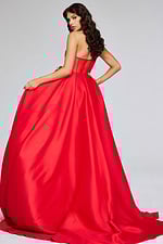 Model showing the back of Jovani 40826 red gown with flowing A-line silhouette