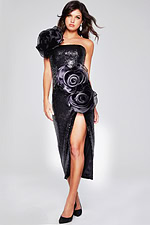 Model in Jovani 40842 black sequin dress, decorated with floral appliqués.