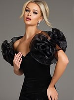 Close-up of model in Jovani 40843 black velvet gown highlighting sweetheart neckline and sculptural sleeves.