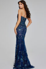 Model wearing Jovani 40847 navy strapless mermaid silhouette dress with lace and sequins, back view.