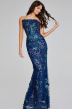 Model wearing Jovani 40847 navy strapless mermaid silhouette dress with lace and sequins, alternative front view.