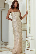 Model in Jovani 40887 nude column gown, details of strapless neckline.