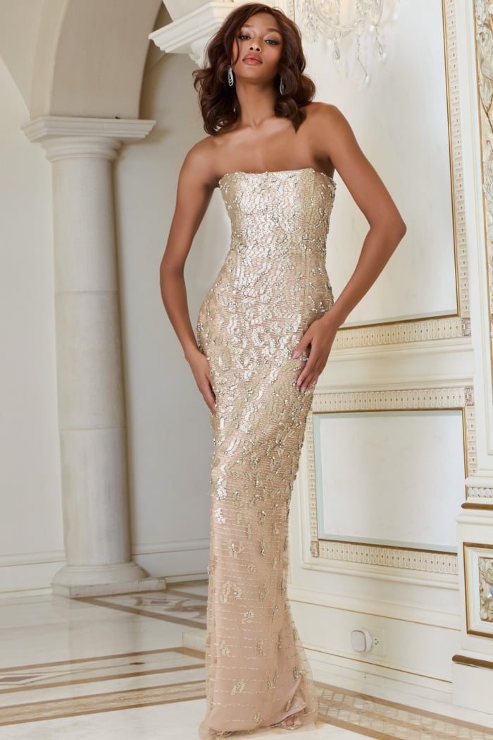 Model showcasing Jovani 40887 fitted nude gown with intricate beadwork.