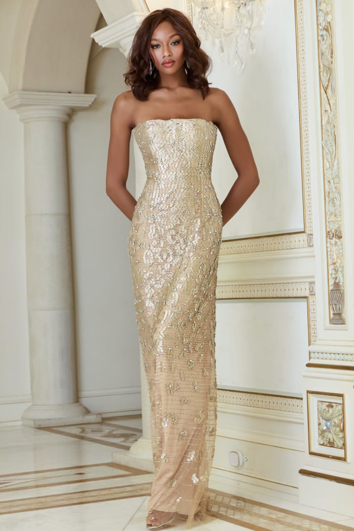Model wearing Jovani 40887 nude strapless full-length gown from the front.