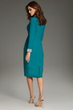 Model wearing Jovani 40910 blue dress with embellished cuffs, back view.