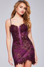 Model posing in Jovani 40922 purple mini dress with sequin details and sweetheart neckline.