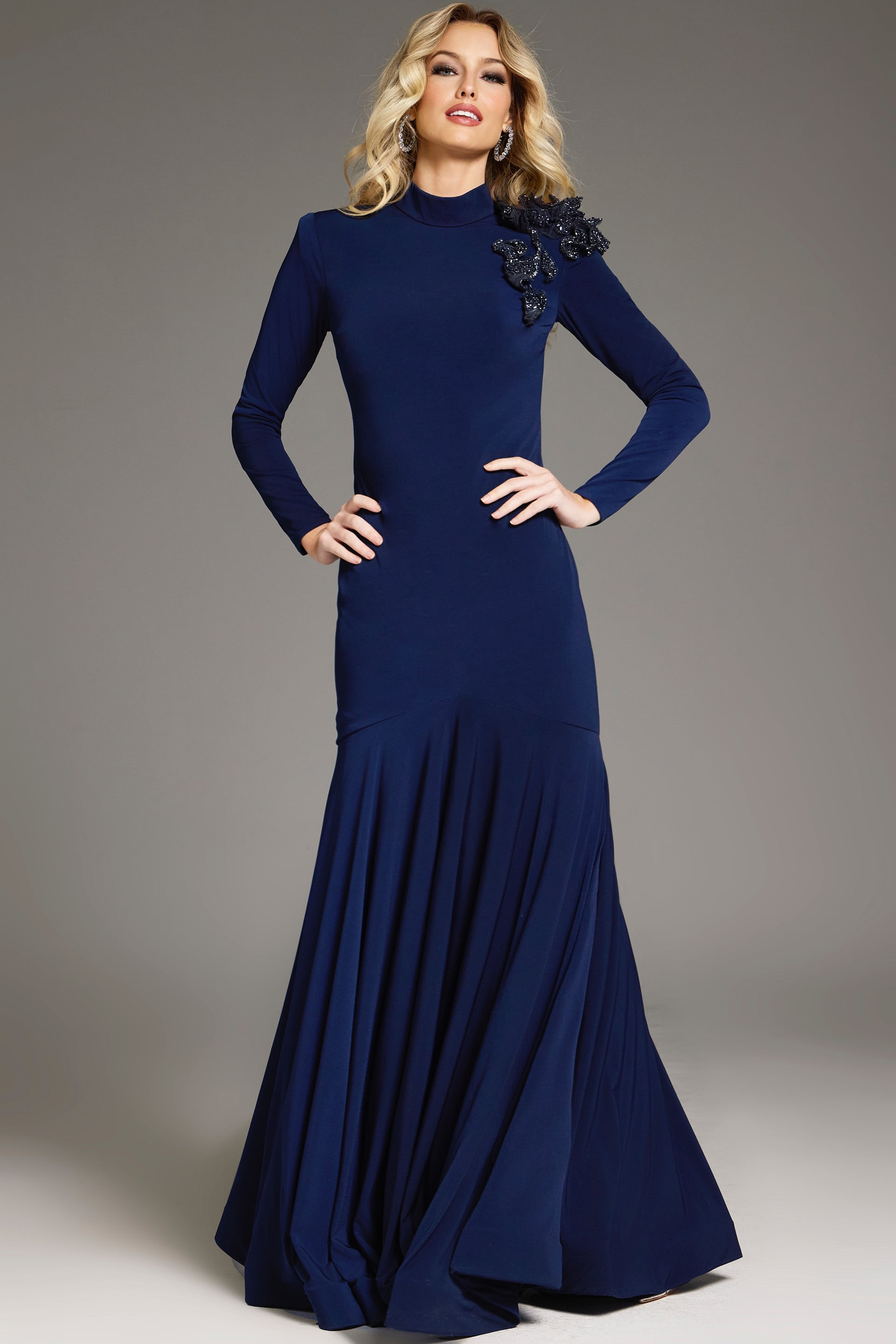 40926-navy Model wearing Jovani 40926 navy dress with mermaid silhouette and floral embellishment from the front.