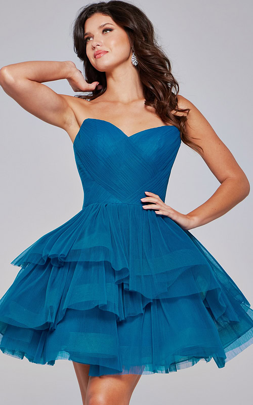 Model wearing Jovani 41054 blue dress showcasing sweetheart neckline and layered tulle, front view.