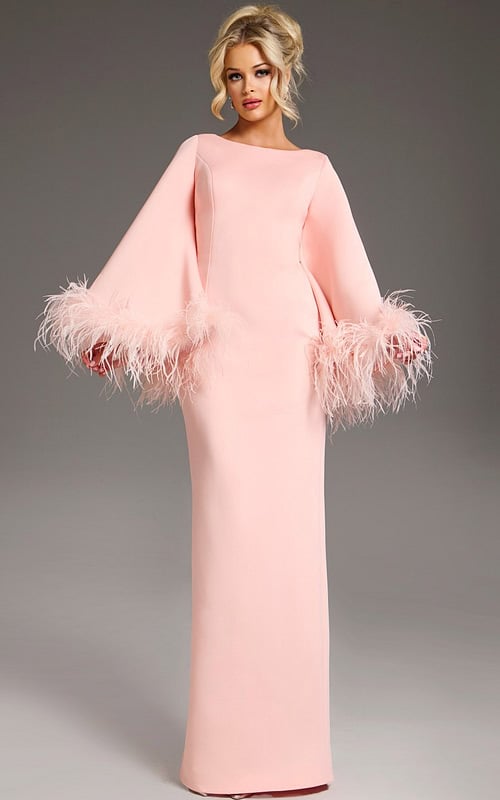 Model wearing Jovani 41077 blush gown with bell sleeves and feather accents from the front.