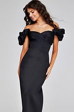 Model in Jovani 41084 black dress with ruffled sleeves, front view.
