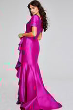 Model wearing Jovani 41128, side-back view of the lilac mermaid gown.