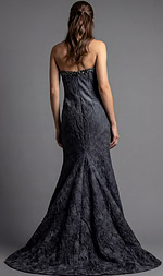 Back view of strapless evening gown with textured fabric and floor length flared hem