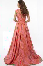 A line gown with open V back and flowing floor length skirt