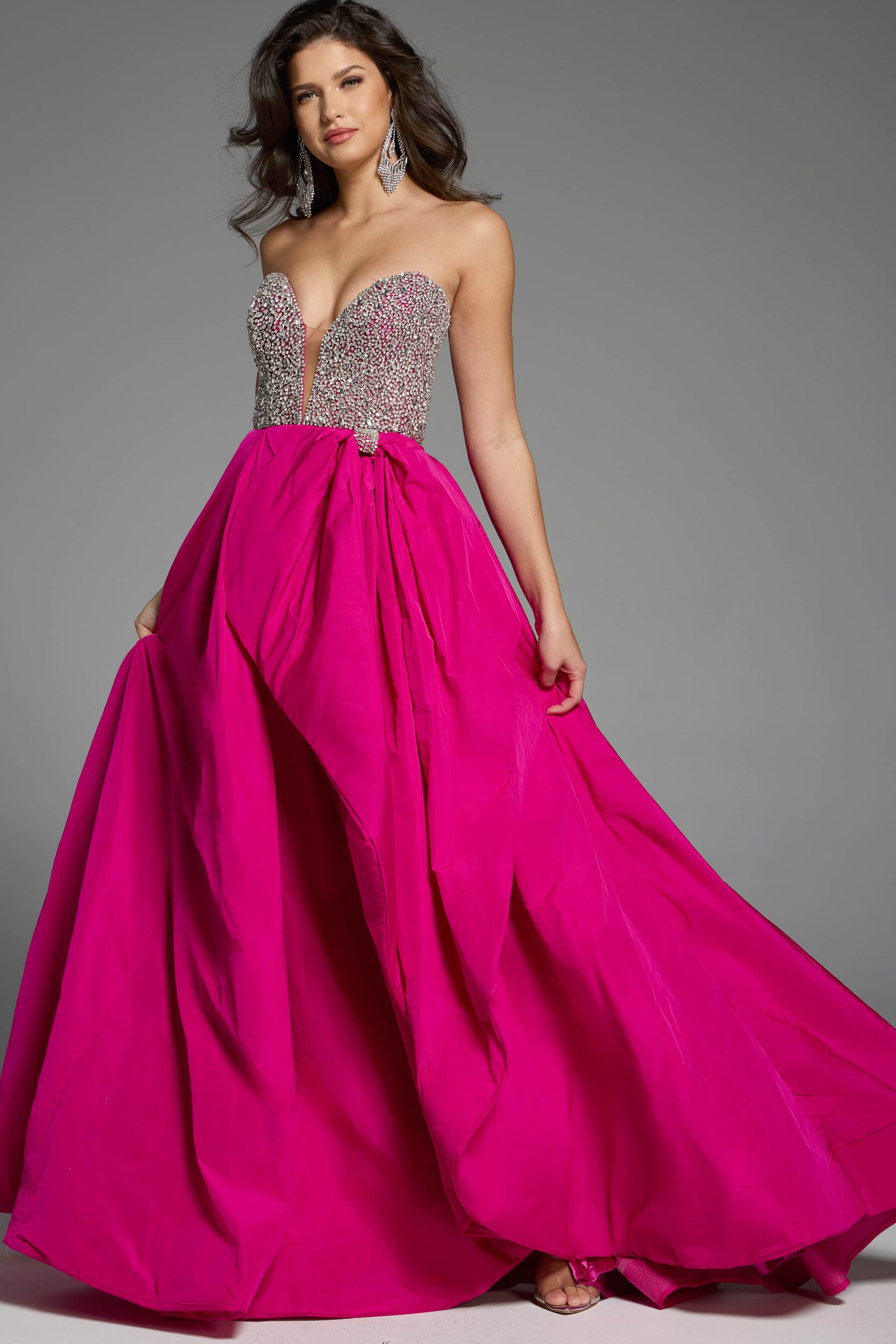 41141_FUC_013 Full-length strapless gown with shimmering crystal detailing and bold ruffle accents