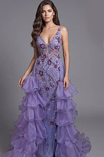 Sheer embroidered gown with cascading ruffles and fitted bodice
