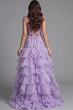 Formal gown with beaded bodice, deep neckline, and layered organza ruffles