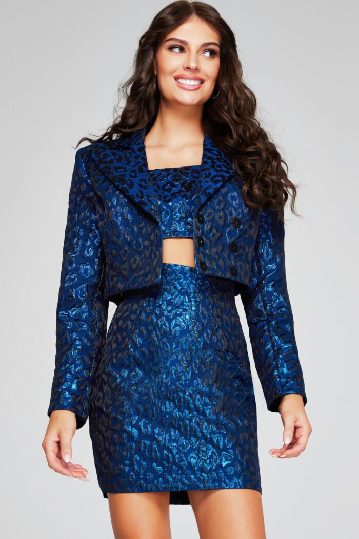 Model wearing Jovani 42134 navy mini dress with front view showing crop top and jacket.