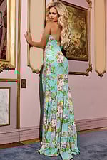 Back view of model in Jovani 42145, showing flowing silhouette and floral pattern.