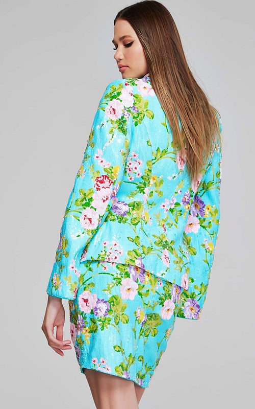 Model wearing Jovani 42147 dress showcasing the multi-color floral pattern with unique slit sleeves from the back.