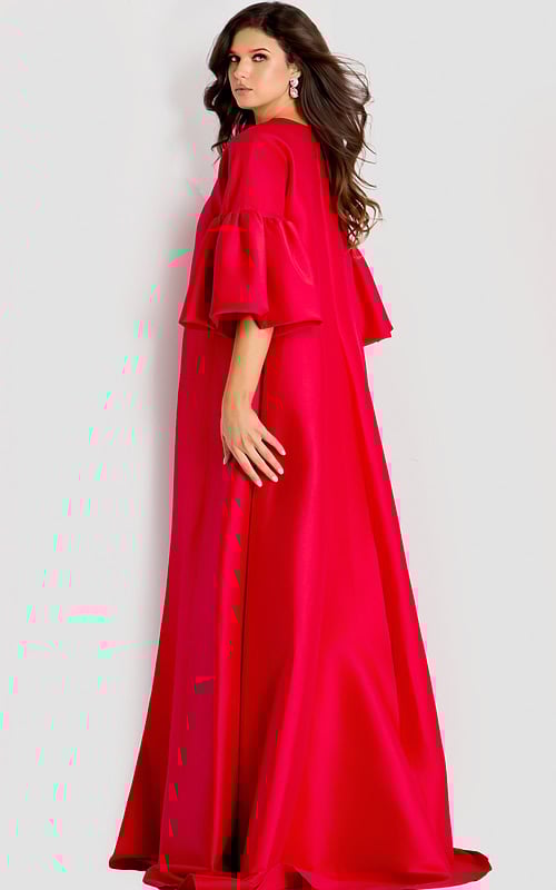 Dramatic satin cape gown featuring voluminous tiered sleeves and a flowing full-length silhouette for an elegant statement look.
