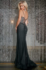 Model wearing Jovani 42290 elegant black gown with lace-up back detail.