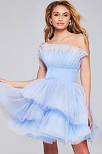 Model wearing Jovani 42340 blue dress with strapless neckline and layered tulle skirt.