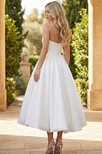 Strapless white high low wedding dress with full bubble skirt and back view details