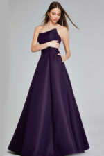 Model wearing Jovani 42347 purple strapless A-line evening gown, angled front view