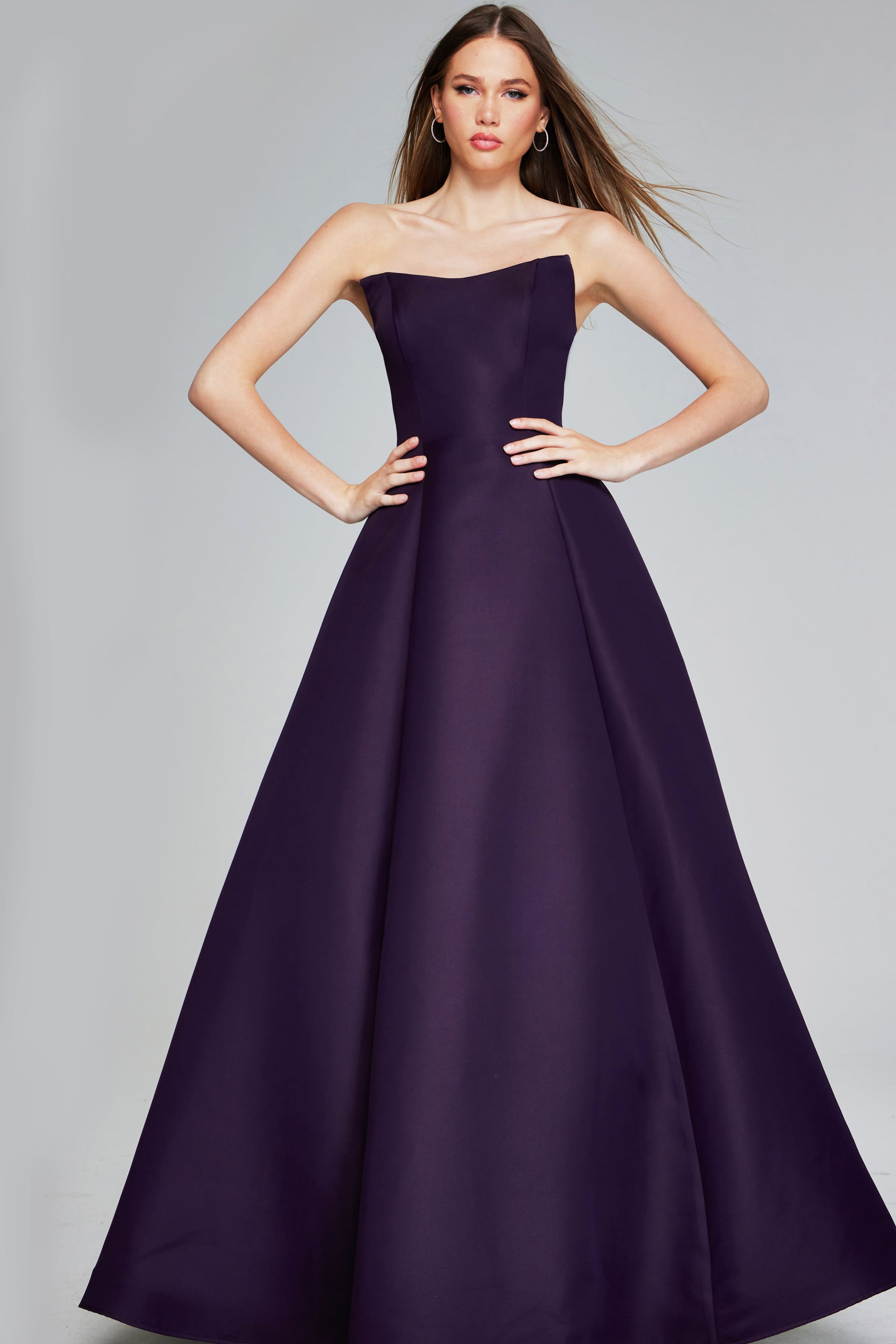 42347-EGGPLANT-205.jpg Model wearing Jovani 42347 purple strapless A-line evening gown, front view