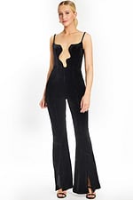 Front view of black velvet jumpsuit with deep wavy plunging neckline