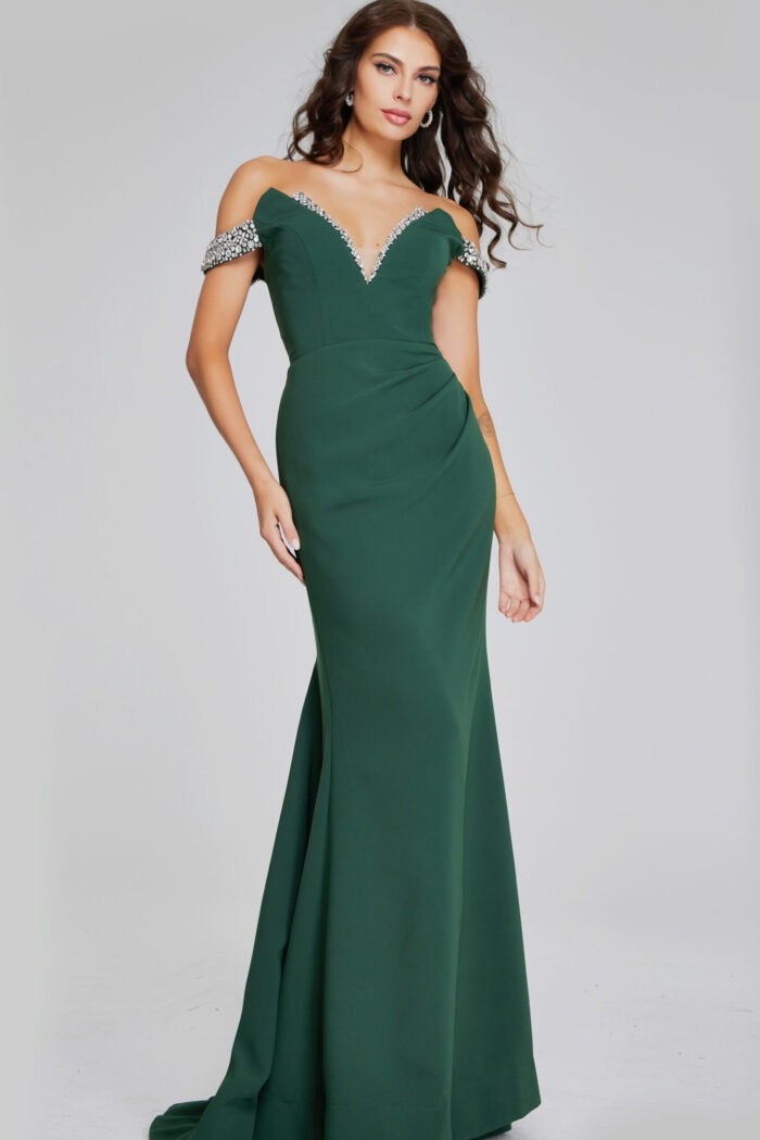 Model wearing Jovani 42394 floor-length green gown with beaded off-the-shoulder neckline from the front.